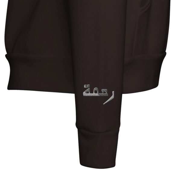 Close-up of Rahmah embroidery stitching detail on a cozy hoodie by Artkins