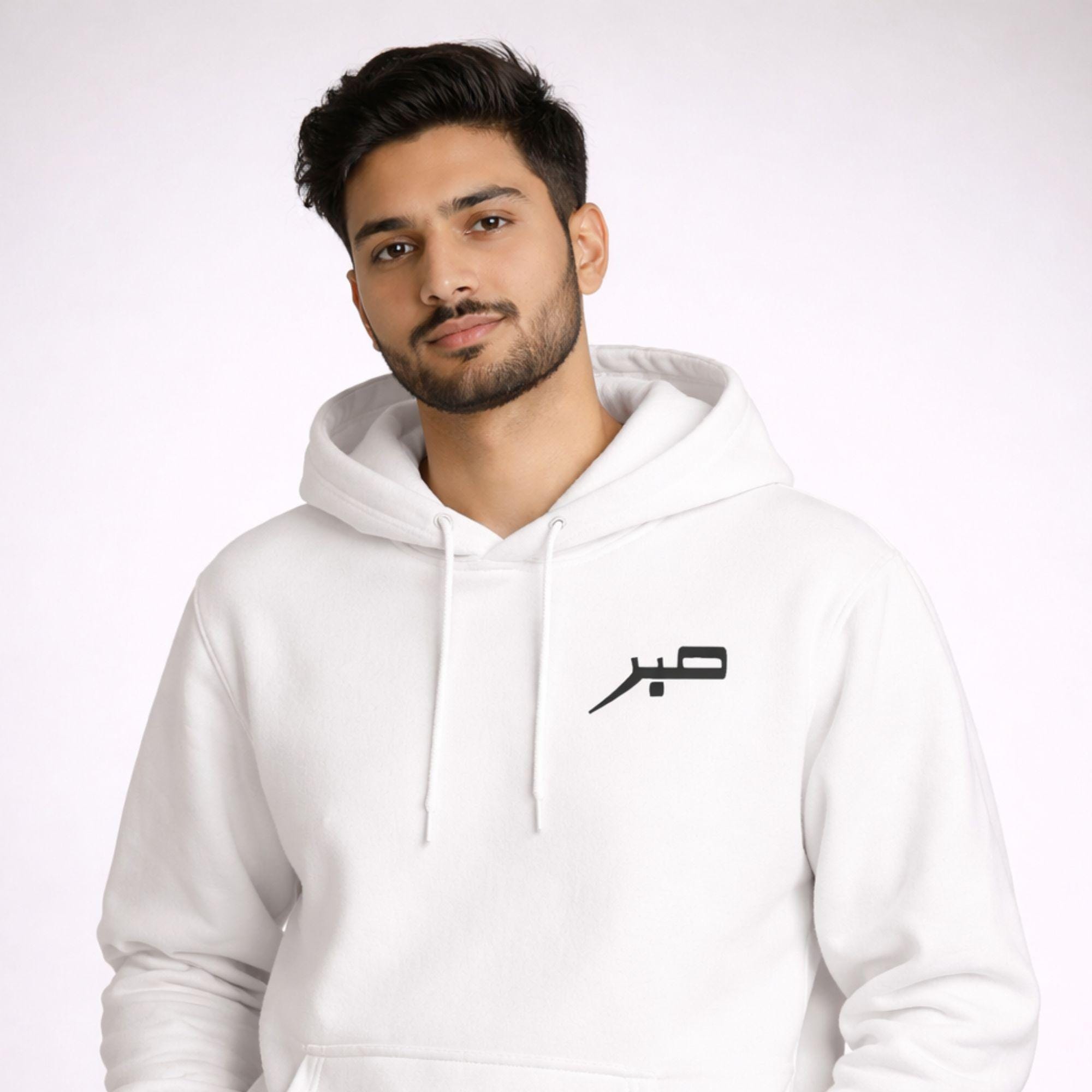 Close-up of Sabr Arabic embroidery detail on unisex hoodie from Artkins