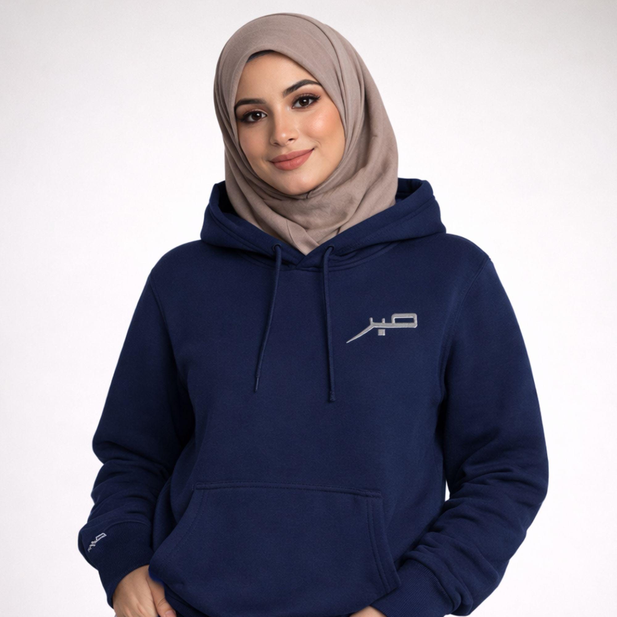Front view of embroidered Sabr unisex hoodie showing clean chest embroidery