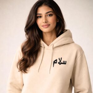 Person wearing Artkins salam embroidered hoodie, styled casually in everyday streetwear