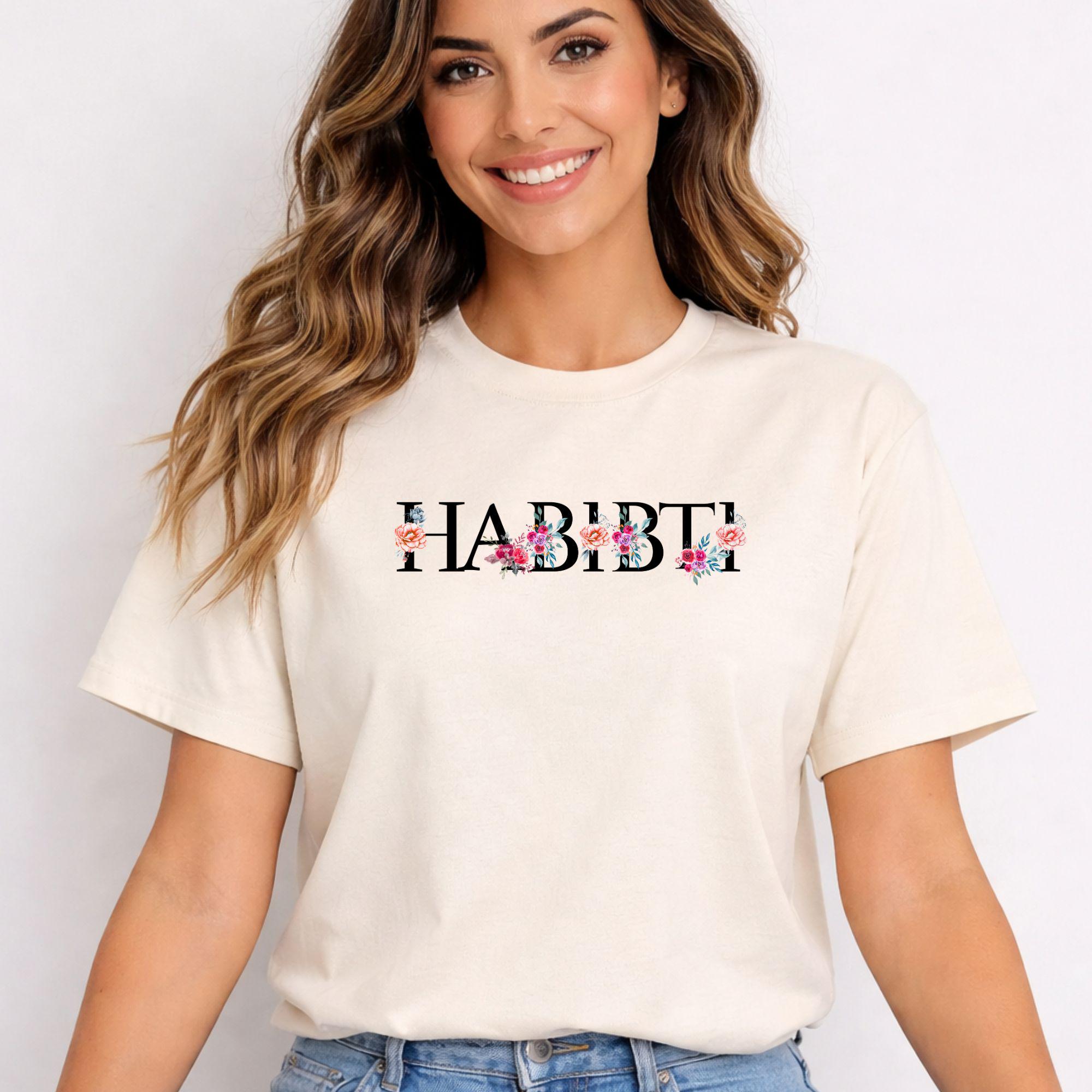 Front view of Artkins Habibti shirt showing full floral Arabic lettering design