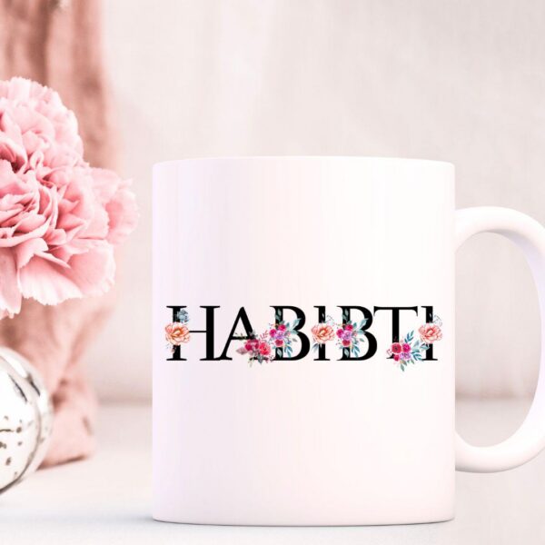 Habibti Arabic mug with floral calligraphy design on glossy white ceramic and colored handle