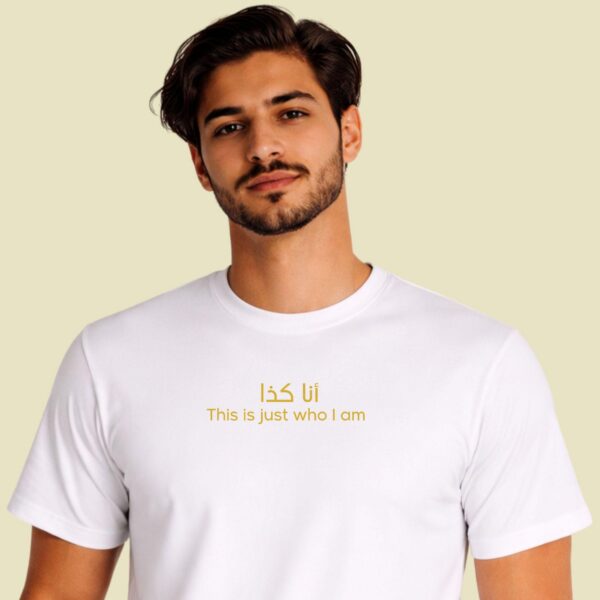 Close-up of gold Arabic calligraphy script on bold identity statement shirt by Artkins