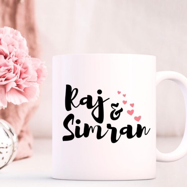 Close-up of couple portrait mug with colorful South Asian wedding outfit detail