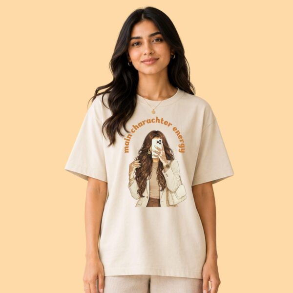 Artkins brown girl main character tee styled with wide-leg jeans, soft girl aesthetic streetwear